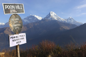 Poon hill altitude sign with Annapurna range in background, Nepa